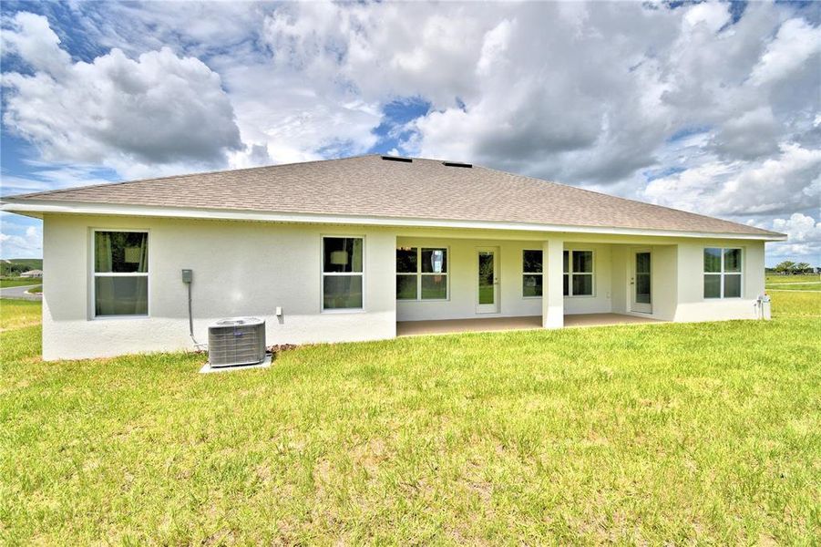 Exterior details and patio area of a home in Cadence Crossing, Auburndale (Image 3).
