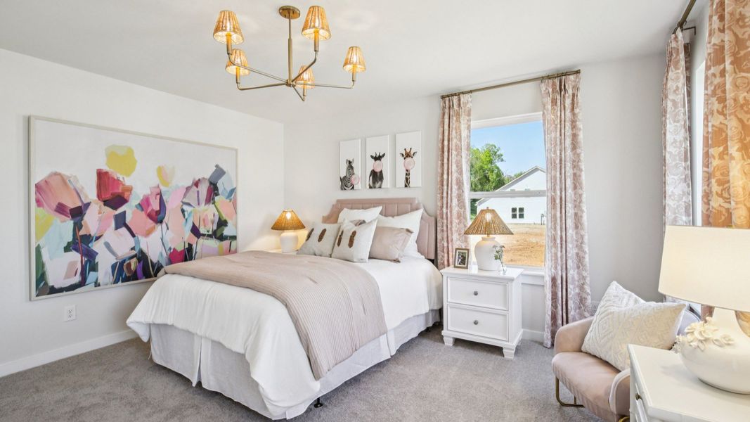 Bedroom with carpet and windows
