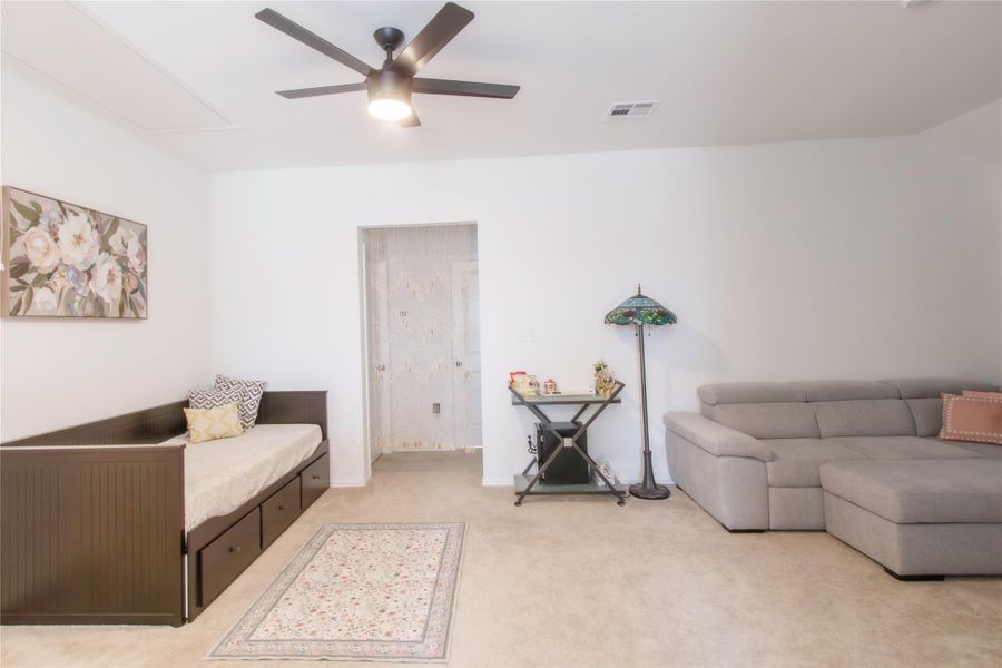 Spacious sitting room/ game room separating the upstairs bedrooms, adding privacy/