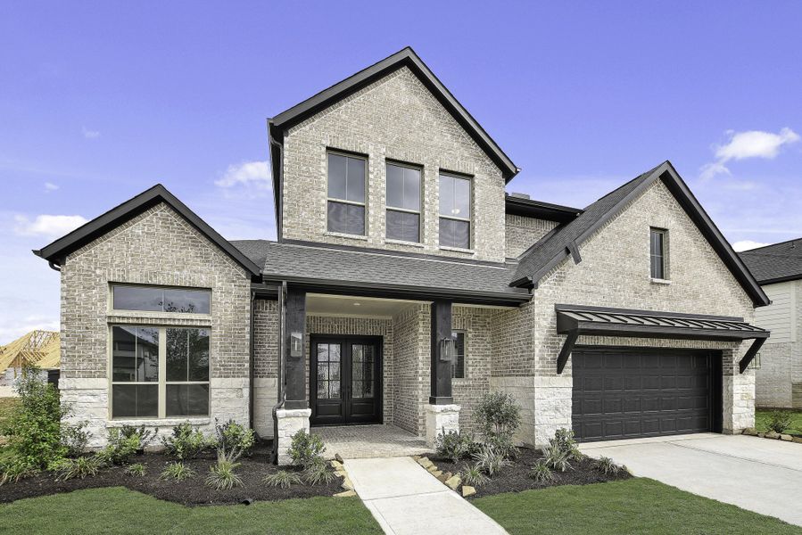 Front exterior of a new home in Harvest Green, Richmond, TX, highlighting curb appeal (Image 2). Front exterior of a new home in Harvest Green, Richmond, TX, highlighting curb appeal (Image 2).