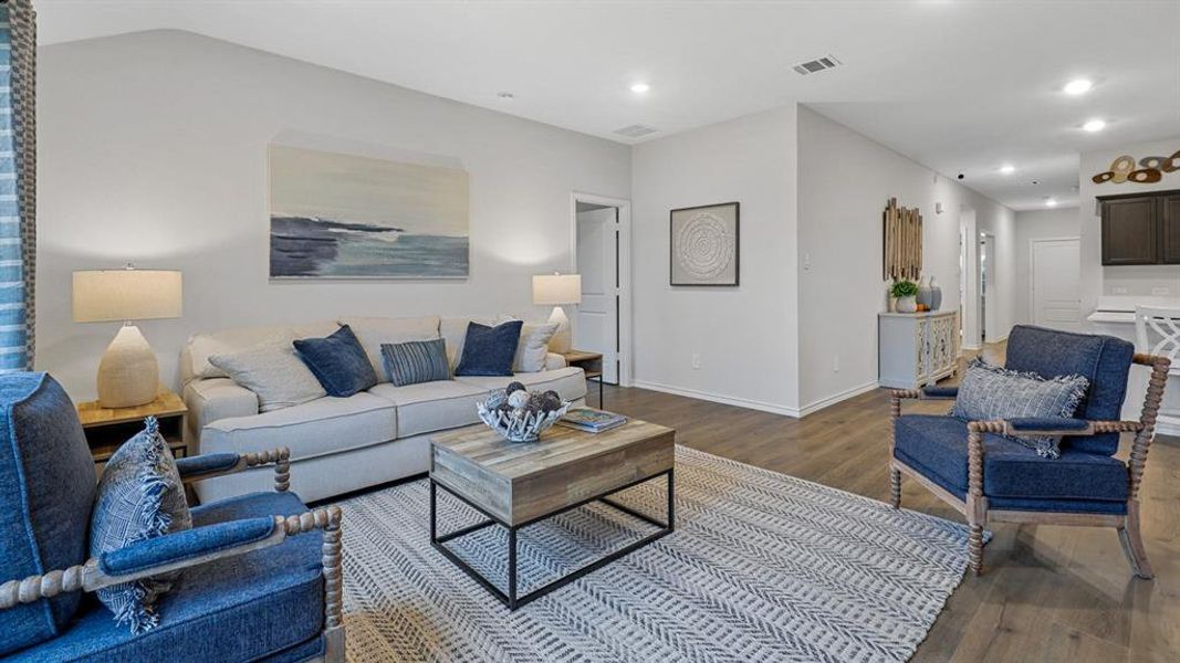 Living area featuring wood finished floors and recessed lighting Living area featuring wood finished floors and recessed lighting