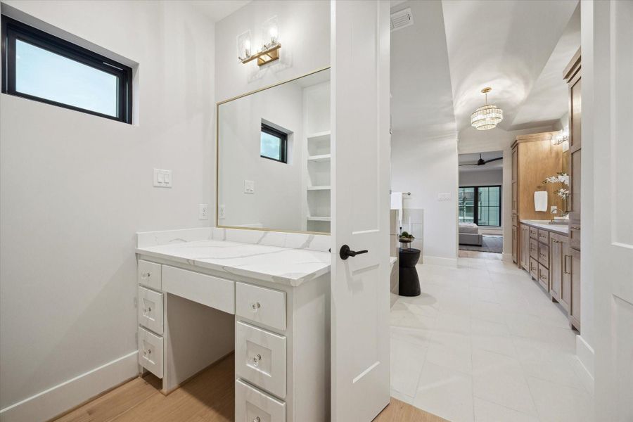 Make-up vanity located within the primary closet.