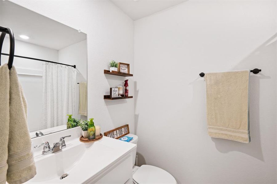 Full bathroom featuring vanity and a shower with shower curtain