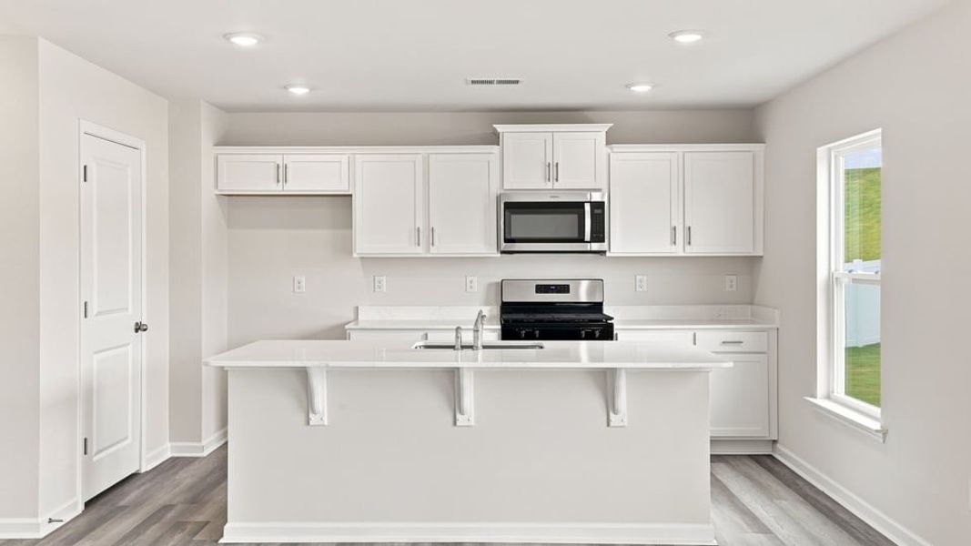 Furnished interior view inside a new home in Lakestone, Woodruff (Image 8).