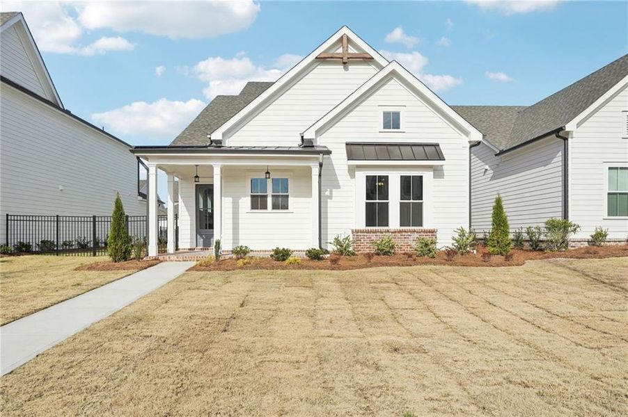 Front exterior of a new home in Promenade at Sawnee Village, Cumming, GA, highlighting curb appeal (Image 28). Front exterior of a new home in Promenade at Sawnee Village, Cumming, GA, highlighting curb appeal (Image 28).