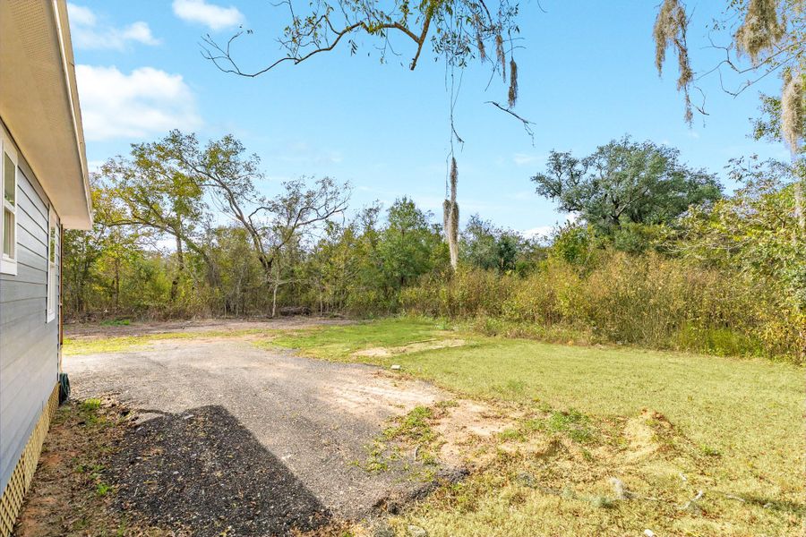 Spacious yard providing additional room for outdoor living, future additions, or recreational space.