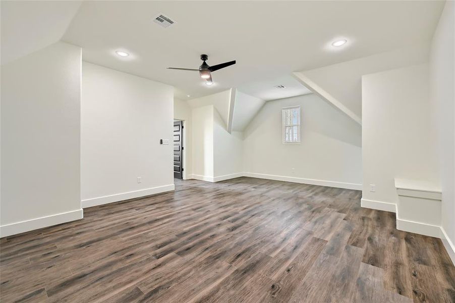 Bonus room with a ceiling fan, visible vents, recessed lighting, and vaulted ceiling