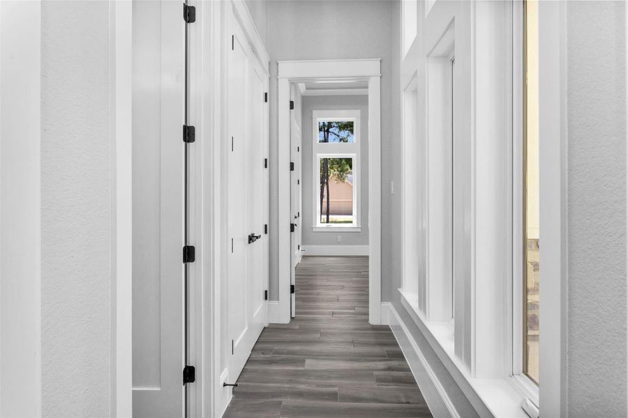 Bedroom #6 is located at the front of the home away from the other Secondary Bedrooms for a little more privacy, so it makes a perfect home office or guest suite.