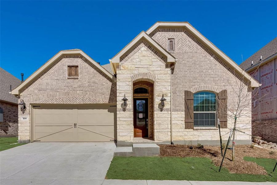 View of front of property with a garage