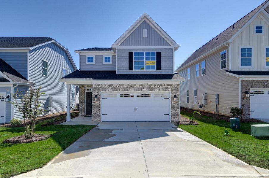 Front exterior of a new home in Ashton Lakes, Lexington, SC, highlighting curb appeal (Image 1).