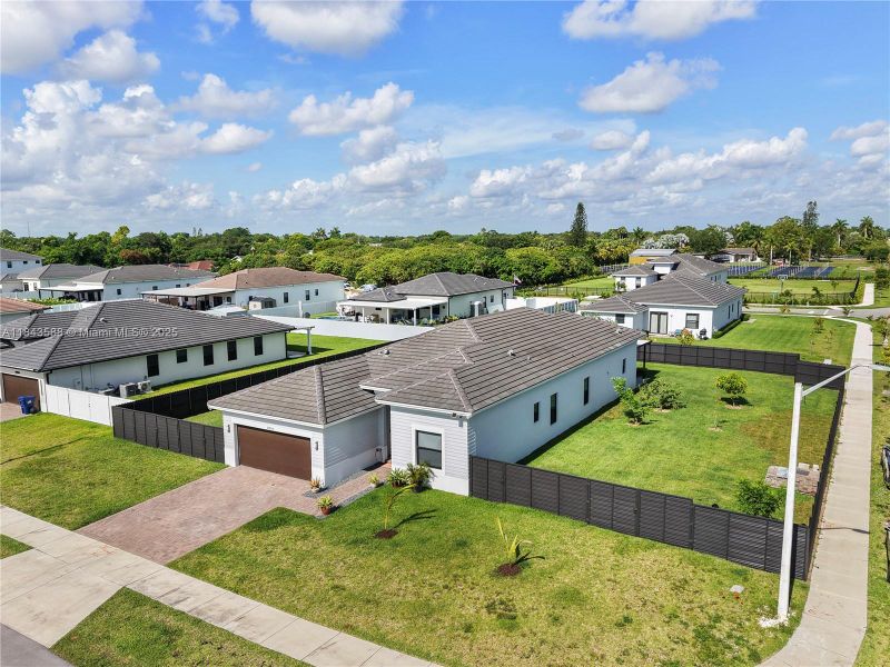Front exterior of a new home in , Homestead, FL, highlighting curb appeal (Image 1).