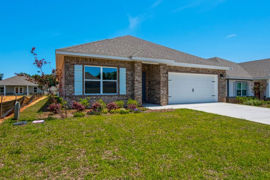 Representative exterior photo of a completed home built from the Seaside by Holiday Builders in Mahogany At Jubilee, Milton, FL (Image 10).