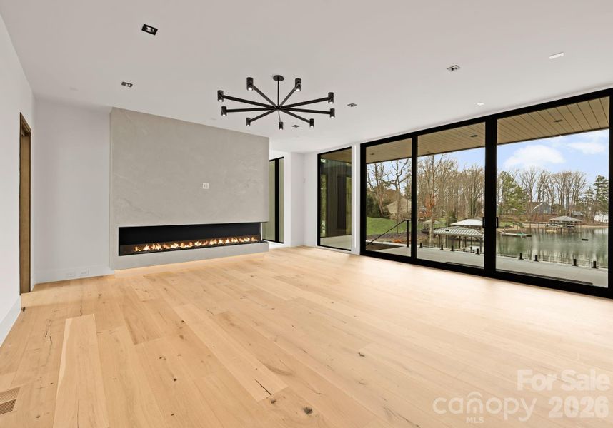 Living room featuring a gas fireplace. Living room featuring a gas fireplace.