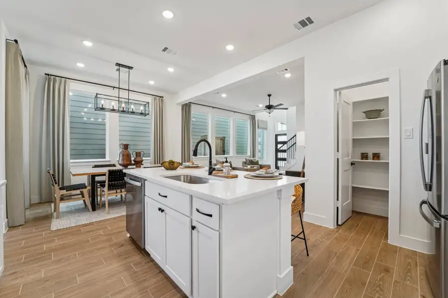 Furnished interior view inside a new home in Bridgeland, Cypress (Image 7).