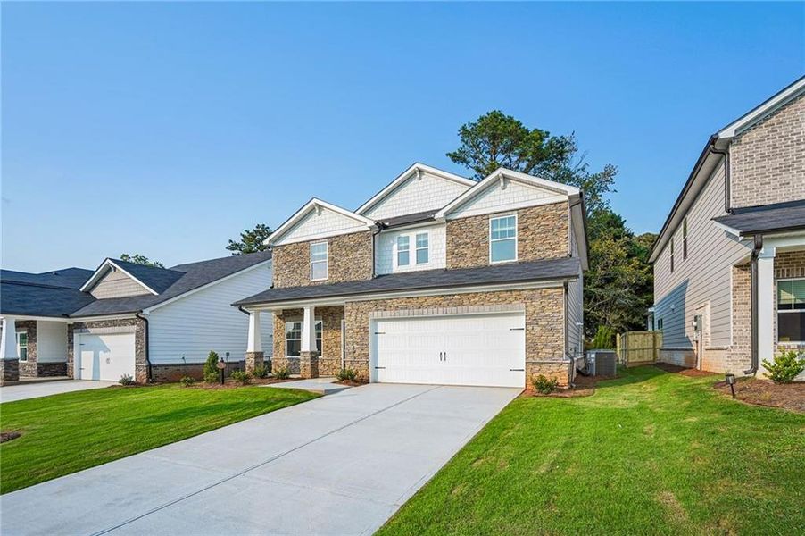 Front exterior of a new home in Martin Springs - Estate Series, Lawrenceville, GA, highlighting curb appeal (Image 25).