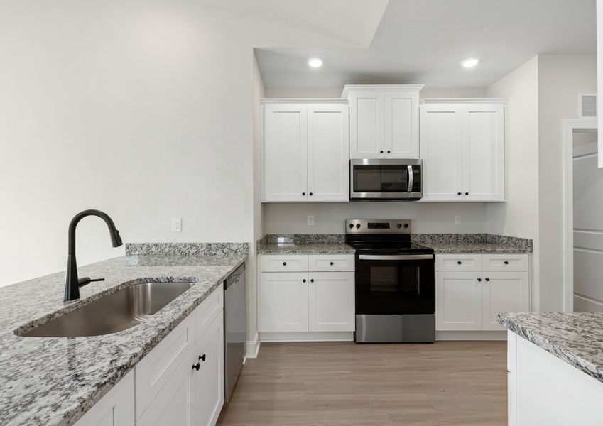 The kitchen has designer wood cabinetry The kitchen has designer wood cabinetry