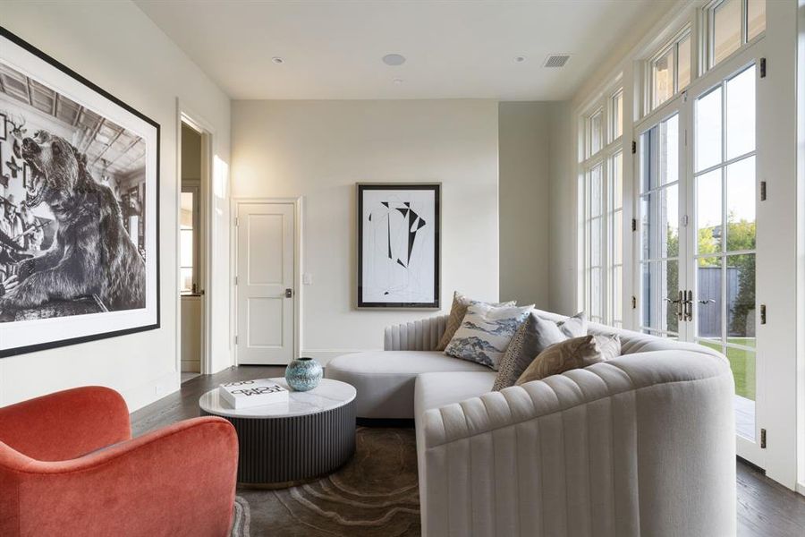 Living area featuring dark wood finished floors and french doors Living area featuring dark wood finished floors and french doors