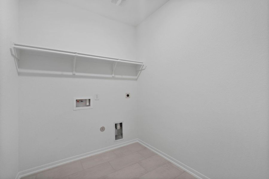 The laundry room layout is carefully planned for optimal workflow with designated areas for washing, drying, and storing. The laundry room layout is carefully planned for optimal workflow with designated areas for washing, drying, and storing.