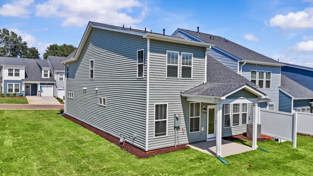 Accomplished exterior with a spacious rear porch that blends comfort and style