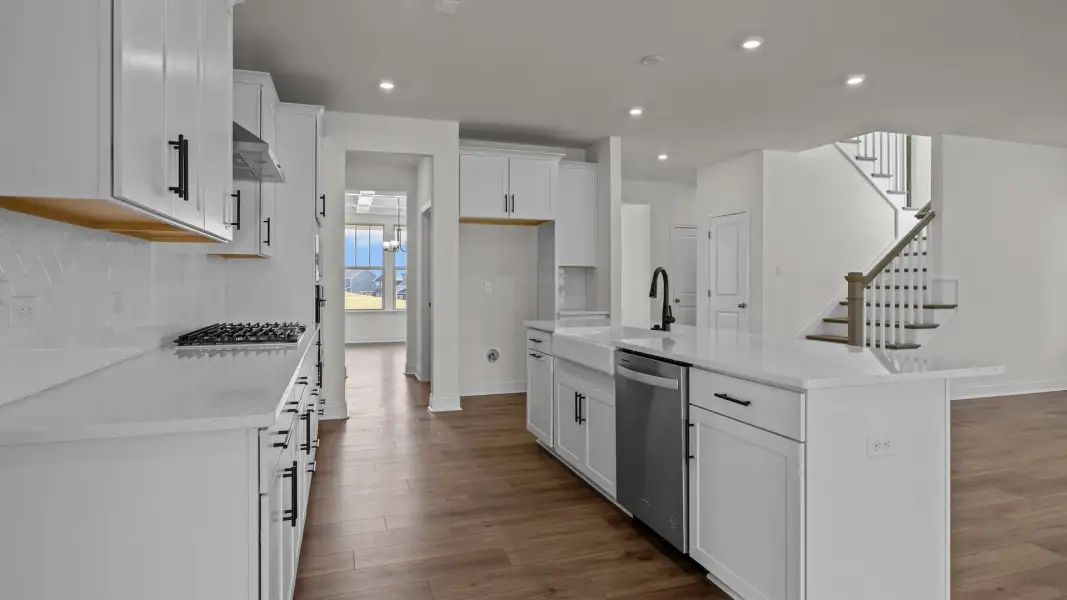 Norris Design gourmet kitchen island and butler's pantry pass through into dining. At Lakeside Glen by DRB Homes in York, SC. Norris Design gourmet kitchen island and butler's pantry pass through into dining. At Lakeside Glen by DRB Homes in York, SC.