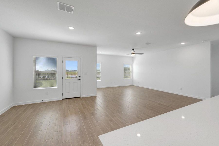 Kitchen open to the dining area and great room (*Photo not of actual home and used for illustration purposes only.)