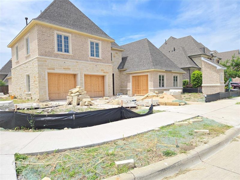 Front exterior of a new home in , Frisco, TX, highlighting curb appeal (Image 2). Front exterior of a new home in , Frisco, TX, highlighting curb appeal (Image 2).