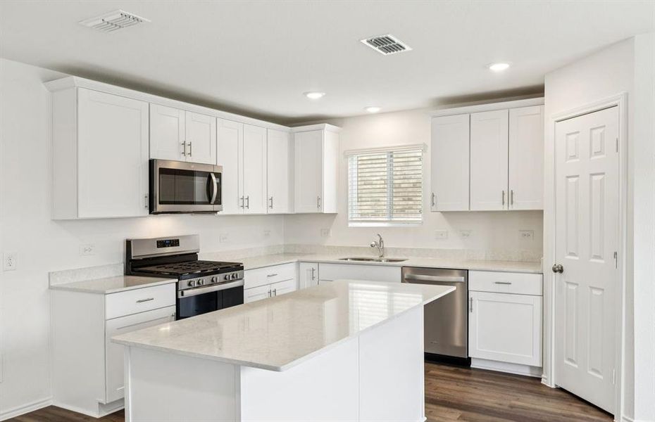 Spacious kitchen with eat-in bar top island Spacious kitchen with eat-in bar top island