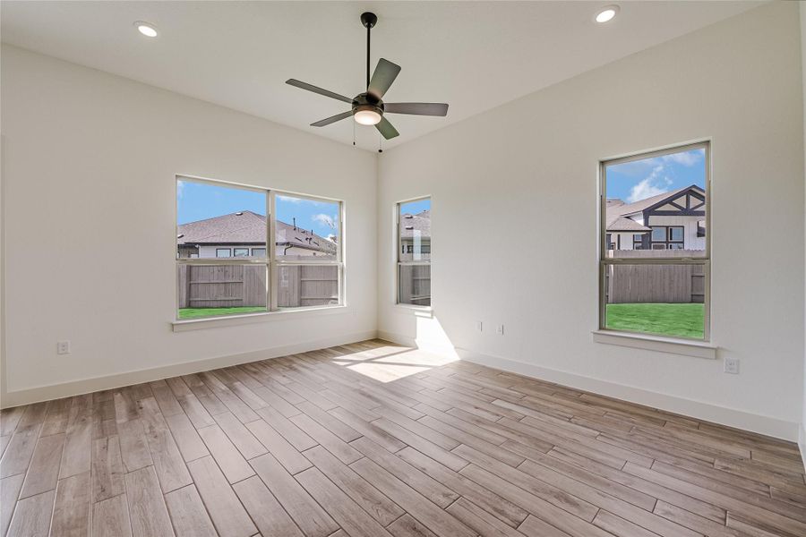 Empty room with recessed lighting, light wood-style floors, and a ceiling fan