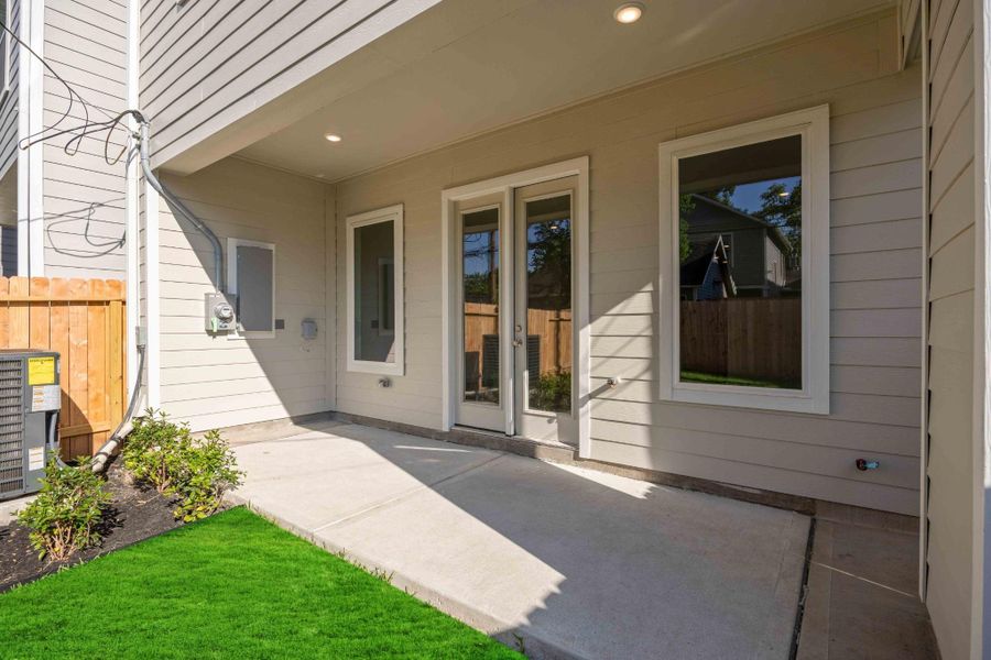 Covered patio means shaded morning coffee, weekend grilling, and outdoor dinners year-round.