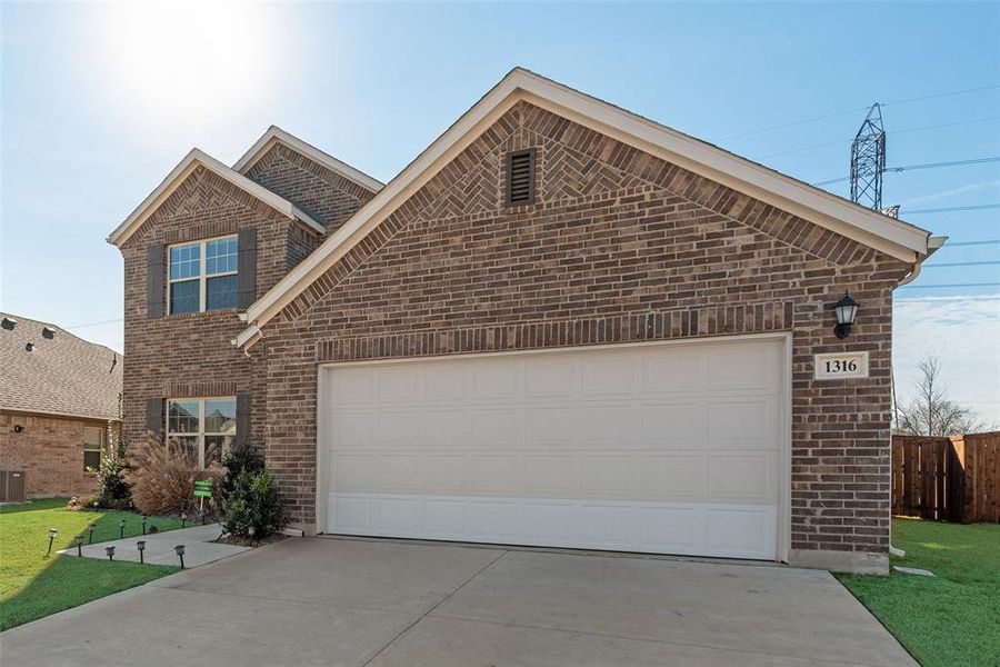 Front exterior of a new home in Hunters Ridge, Crowley, TX, highlighting curb appeal (Image 27).