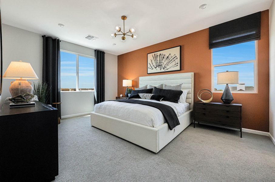 A bedroom with a large bed.