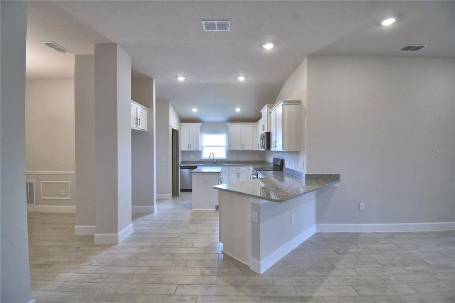 Furnished interior view inside a new home in Cadence Crossing, Auburndale (Image 8). Furnished interior view inside a new home in Cadence Crossing, Auburndale (Image 8).