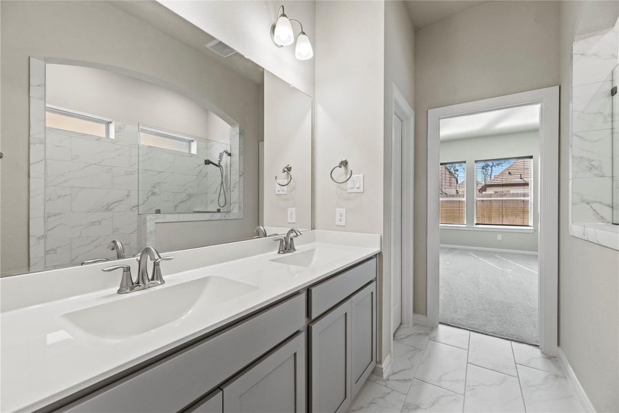 Primary bathroom with dual sinks.