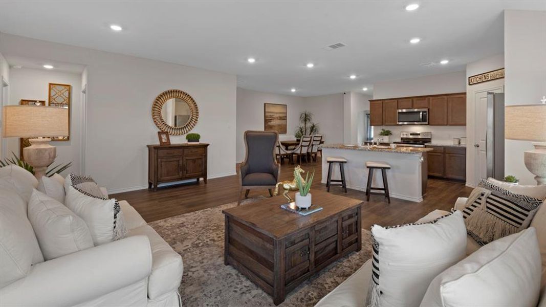 Living area featuring recessed lighting and dark wood finished floors