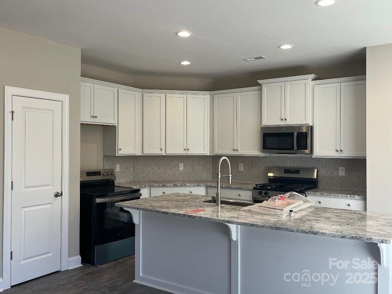 Furnished interior view inside a new home in , Concord (Image 7).