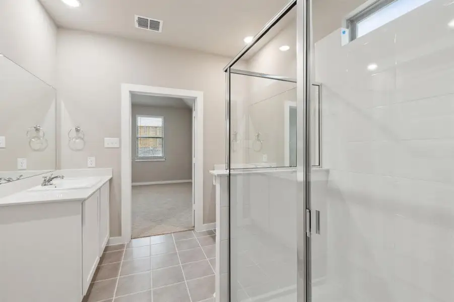 Primary bathroom in the Elm home plan by Trophy Signature Homes – REPRESENTATIVE PHOTO Primary bathroom in the Elm home plan by Trophy Signature Homes – REPRESENTATIVE PHOTO