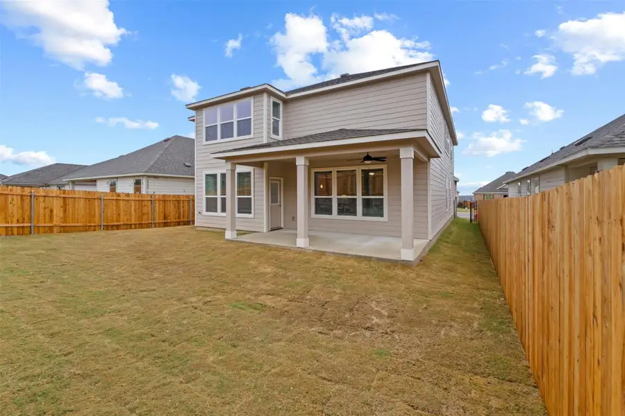 Front exterior of a new home in McKinney Crossing, Austin, TX, highlighting curb appeal (Image 1). Front exterior of a new home in McKinney Crossing, Austin, TX, highlighting curb appeal (Image 1).