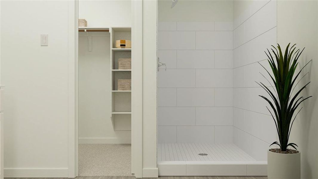 Bathroom featuring tiled shower