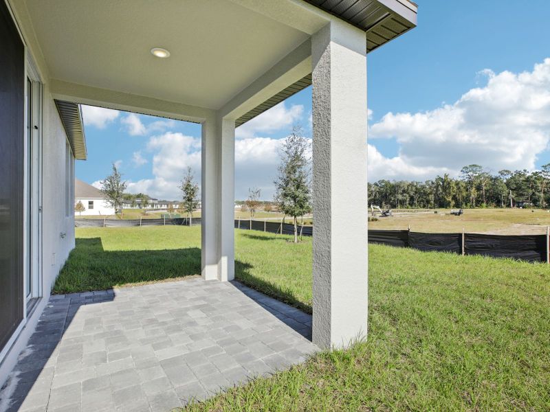 Exterior details and patio area of a home in The Reserve at Hammock Oaks - Classic Series, Lady Lake (Image 3).