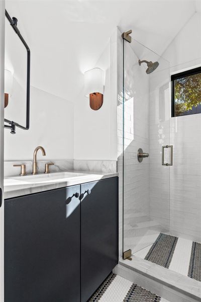 The casita bathroom features a walk-in shower and vanity.