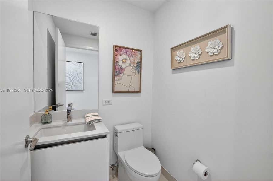 Powder Room near foyer entrance