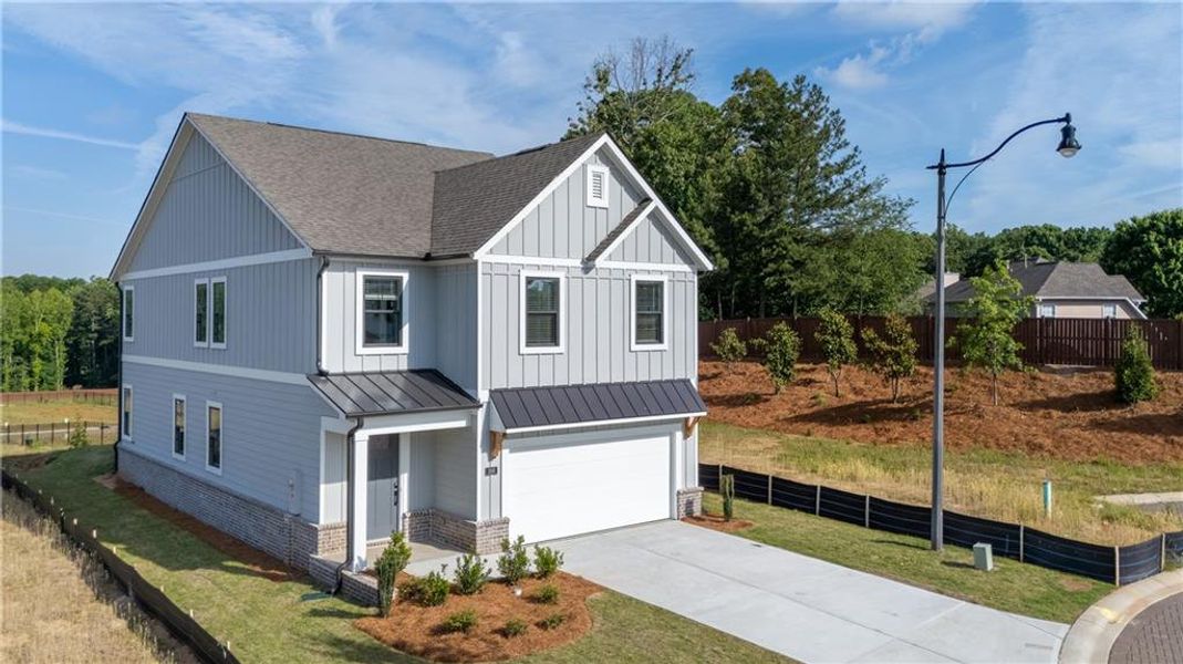 Front exterior of a new home in The Village at Sandy Plains, Marietta, GA, highlighting curb appeal (Image 2). Front exterior of a new home in The Village at Sandy Plains, Marietta, GA, highlighting curb appeal (Image 2).