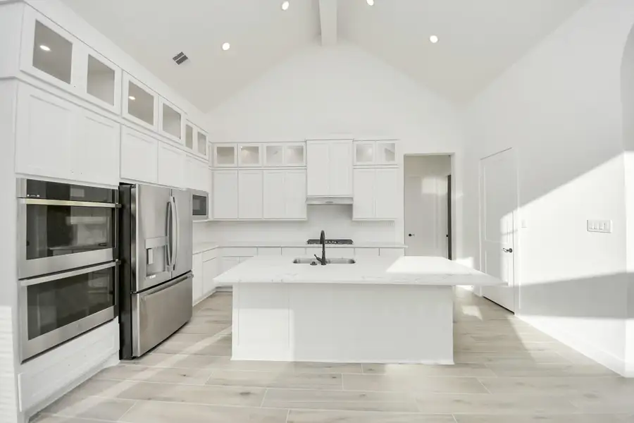 Furnished interior view inside a new home in Meridiana, Manvel (Image 8).