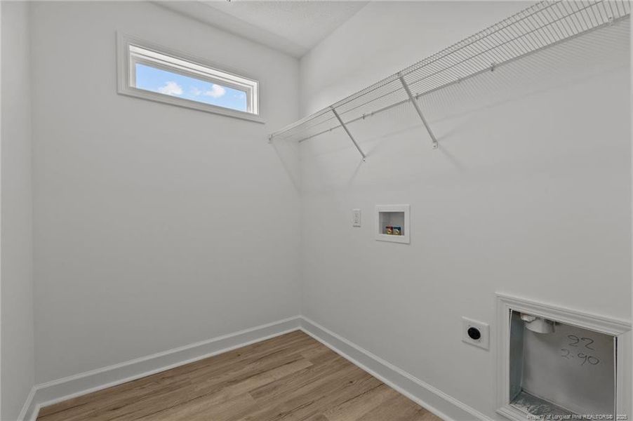 laundry room with LVP