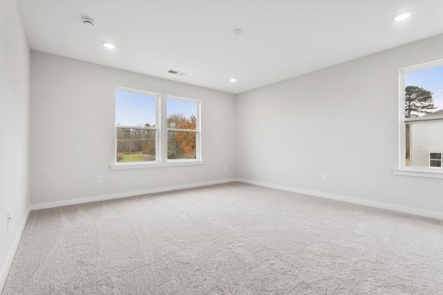 A room with windows and a carpet. A room with windows and a carpet.