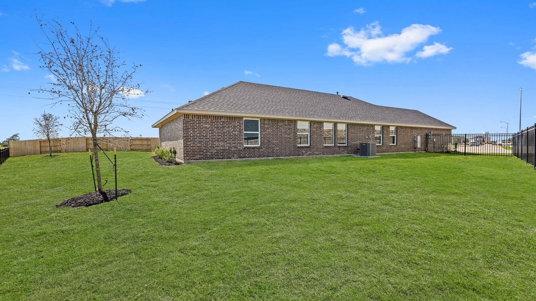 Exterior details and patio area of a home in Sunterra, Katy (Image 4).