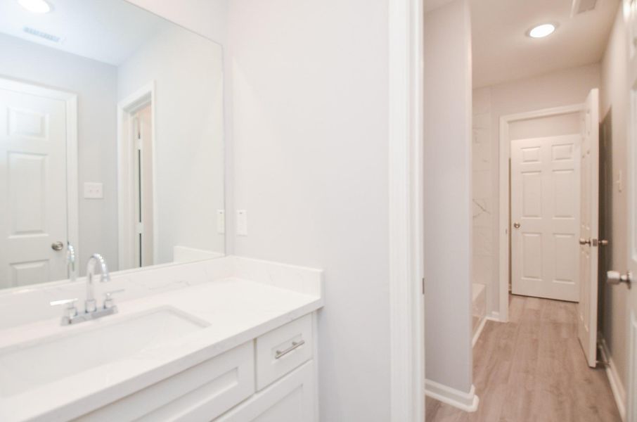 Fresh Jack-and-Jill bath with updated fixtures and a clean, modern feel.