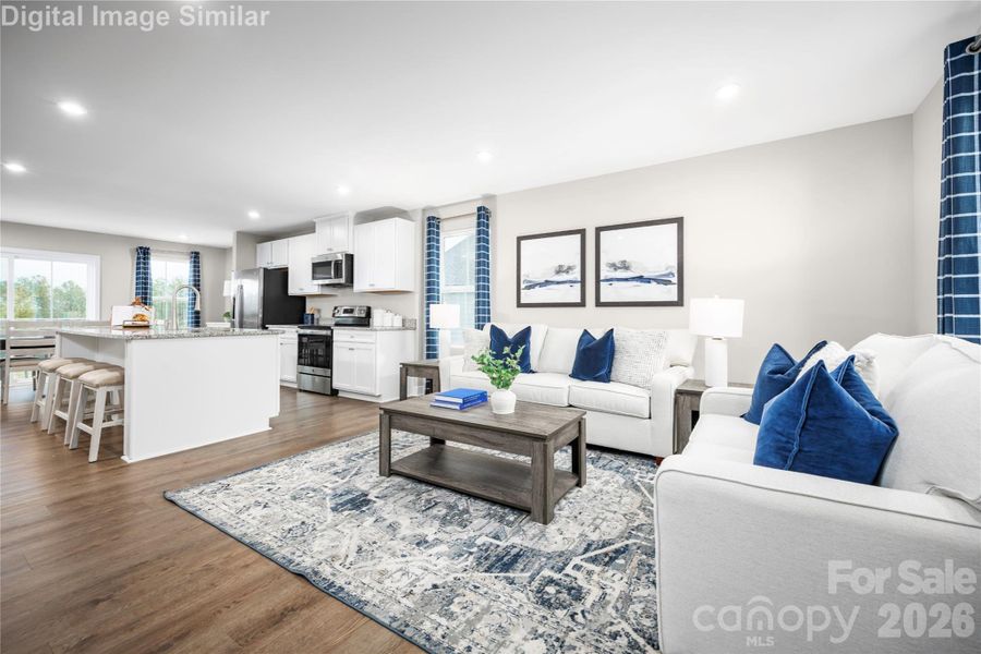 The open floor plan connects the kitchen to the living and dining areas, creating a natural flow that’s perfect for entertaining or keeping an eye on the kids while you cook. It’s a space that invites conversation, connection, and plenty of culinary creativity.
