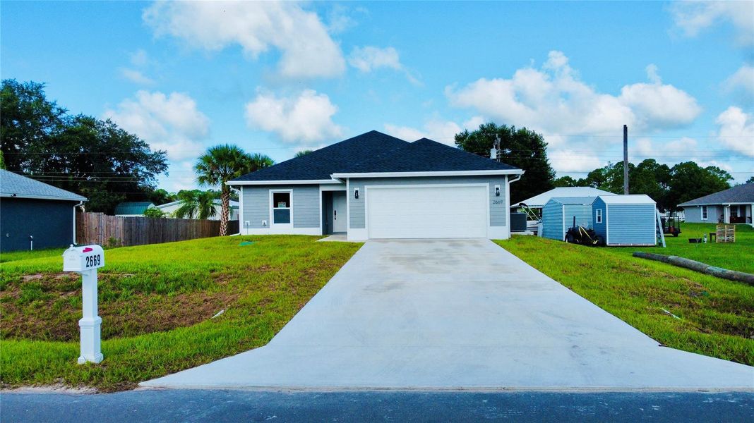 Front exterior of a new home in , Okeechobee, FL, highlighting curb appeal (Image 20).