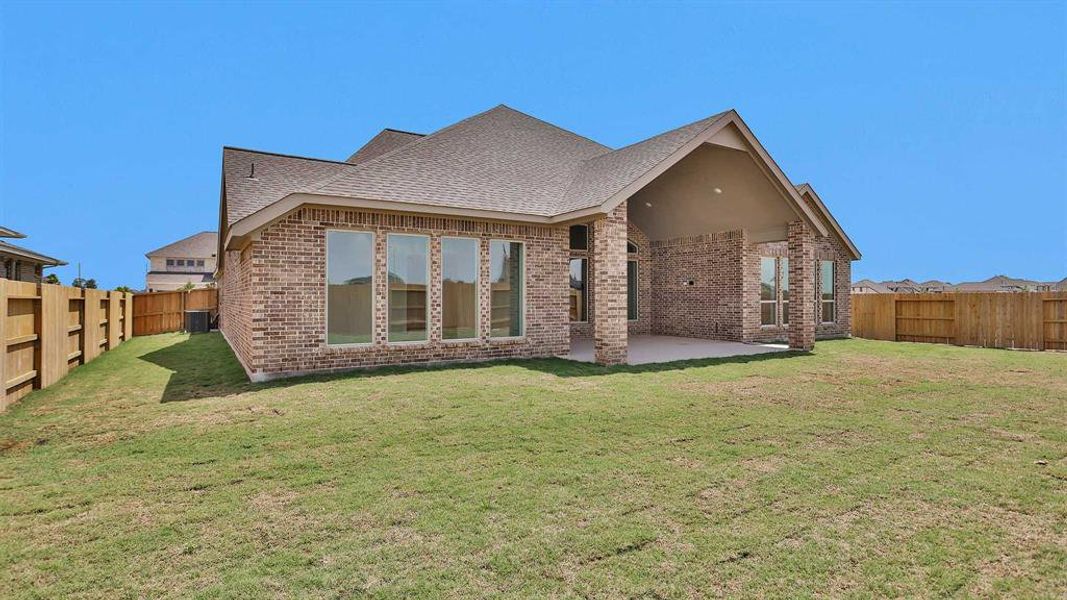 Front exterior of a new home in Valencia 70', Manvel, TX, highlighting curb appeal (Image 2).
